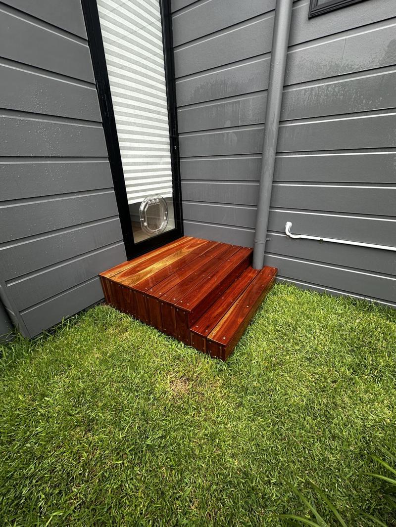 Hardwood steps from the side, showing the boxed-in risers